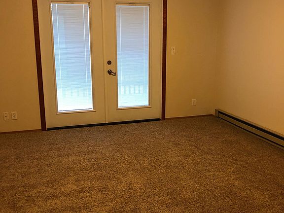 Master Bedroom with french doors out to balcony and walk in closet.