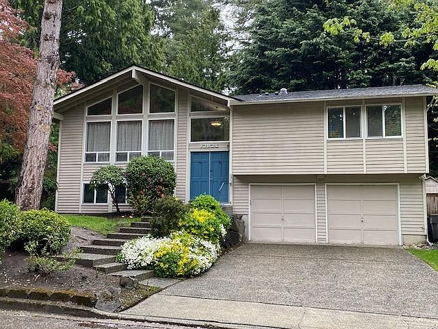 Exterior to be painted mid color green with dark green doors and garage doors, during the next few days.