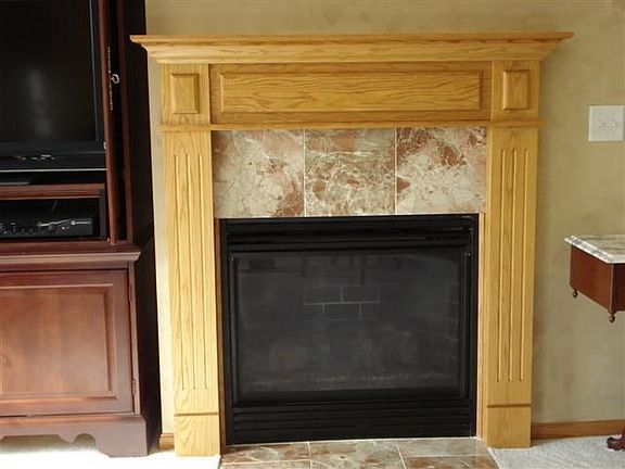 Custom mantle and marble inset