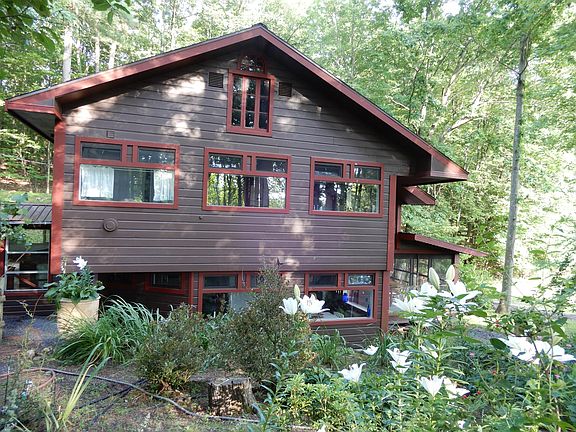 Your master bath and home office overlook gardens on three sides.