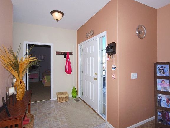 Another view of the entry. Door to the bedroom. Breakfast area in kitchen
