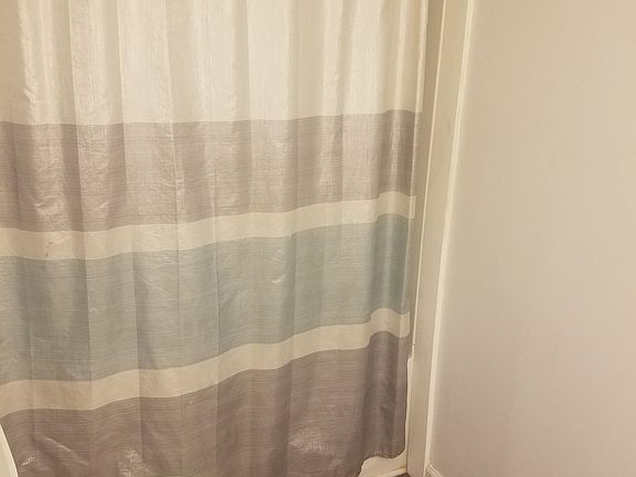 Hall bathroom. Tile floor.