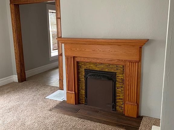 Living room fireplace (inoperable). Carpet is gray as shown in the other living room pictures.