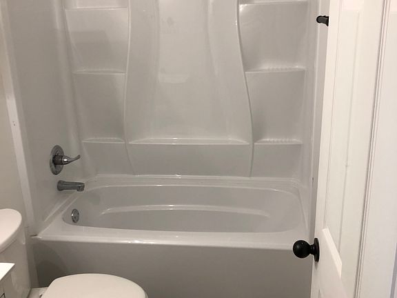 Shower/tub combination - shiny and clean, toilet replaced recently, new flooring