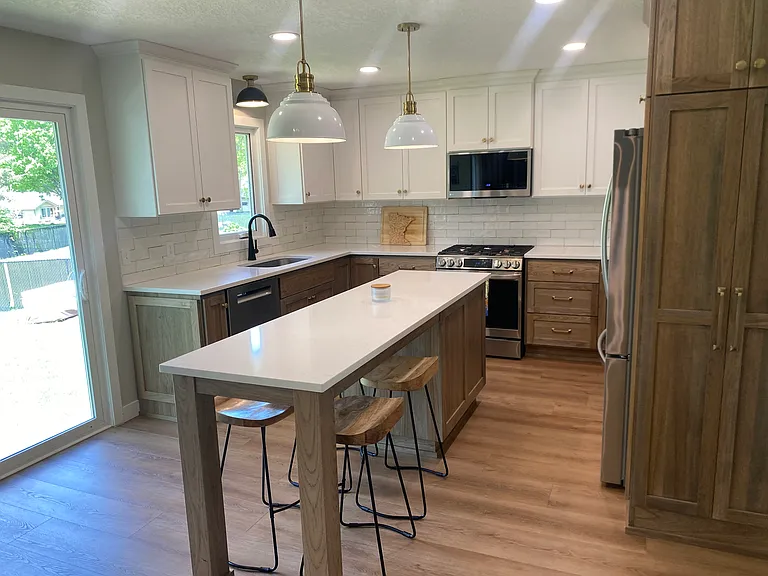 New custom kitchen with quartz countertops and tile backsplash