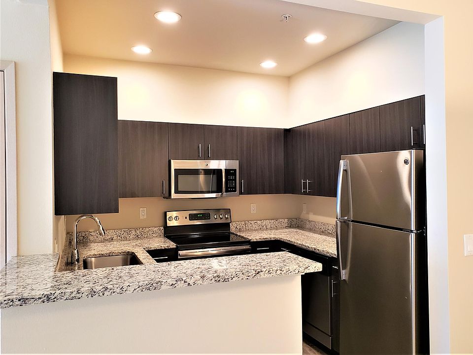 Renovated kitchen with wrap around breakfast bar.