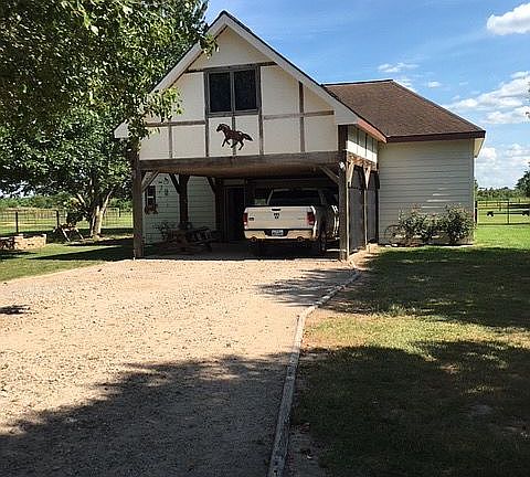 The 2 story Garage/Carport