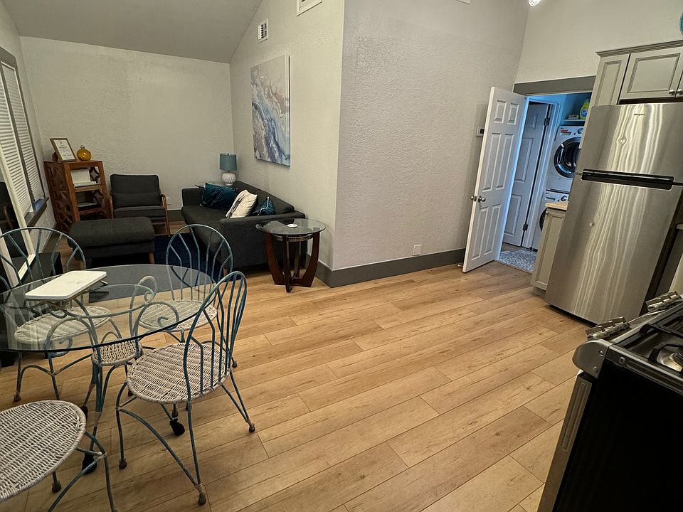 Entry into the top unit with vaulted ceilings and modern fixtures.