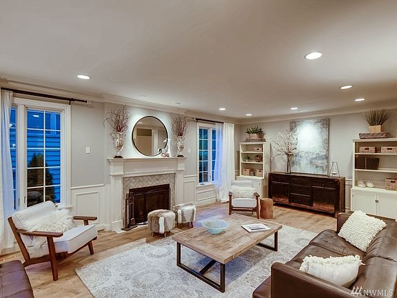 Sunken living room that you can really live in.  Gas fireplace, wainscot, and tons of light if you want it.