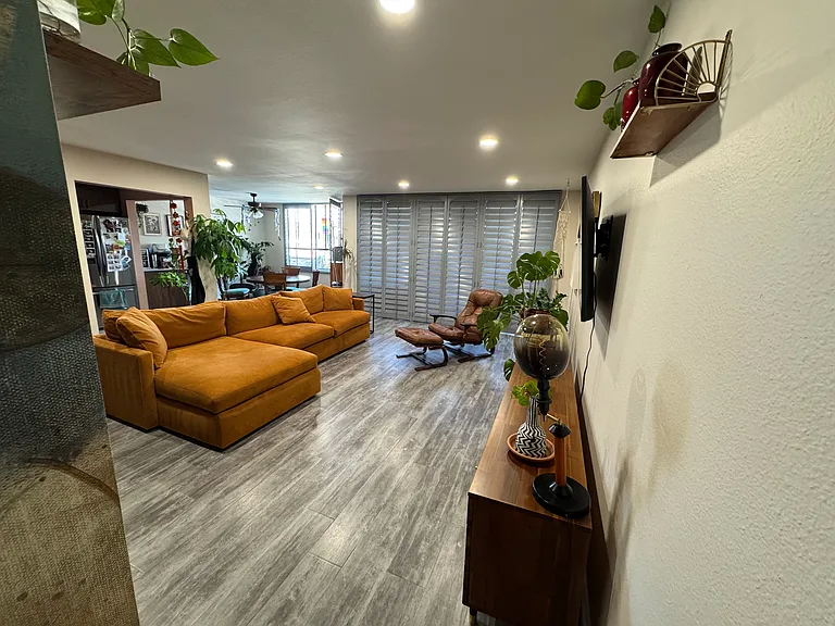 Living Room viewed from guest bathroom doorway.