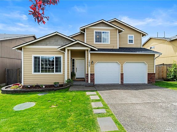 There is plenty of parking with the roomy driveway and the 2 car garage has new doors