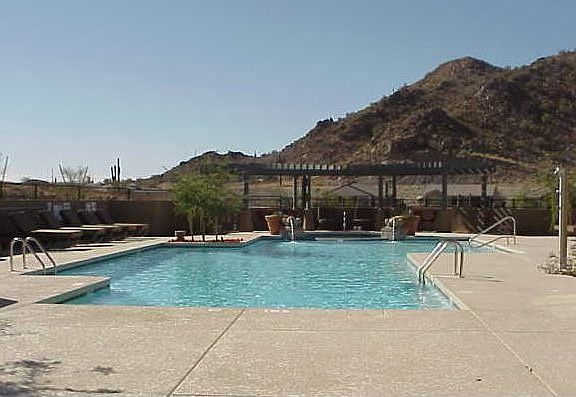 Heated community pool and spa in mountain setting