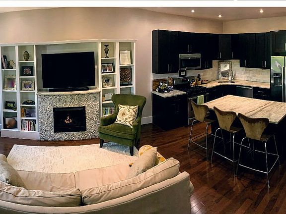 Spacious family room and kitchen with fireplace