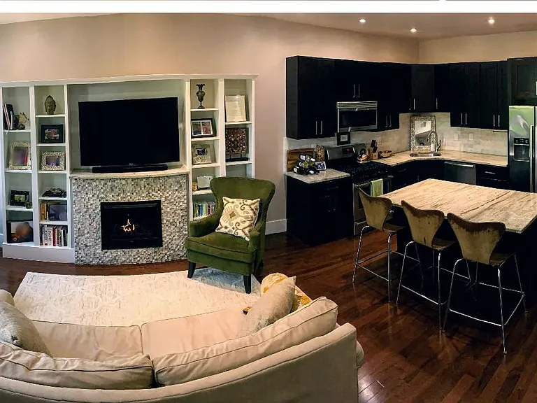 Spacious family room and kitchen with fireplace