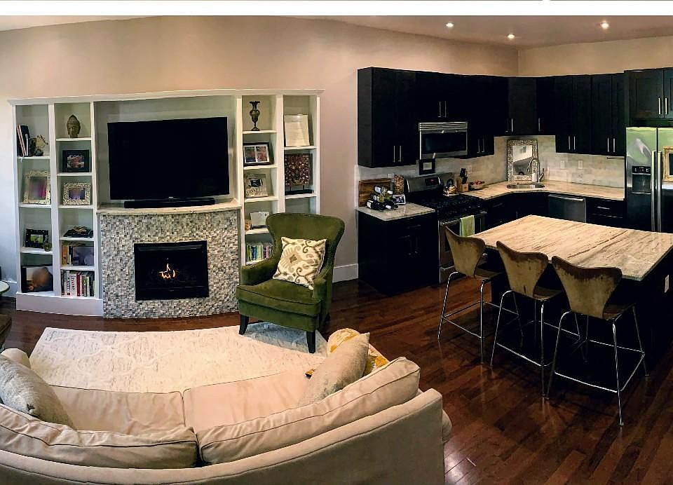 Spacious family room and kitchen with fireplace