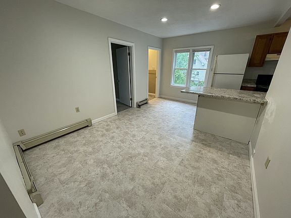 Rear entrance from garage leads to kitchen