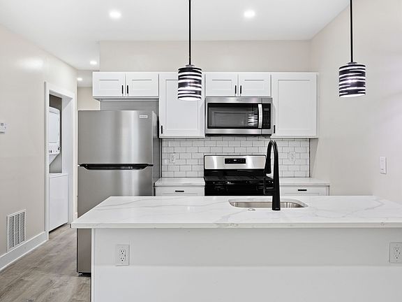 Unit 1 kitchen with bar seating
