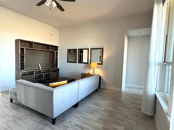Living room - furniture in picture stays; will remove upon request