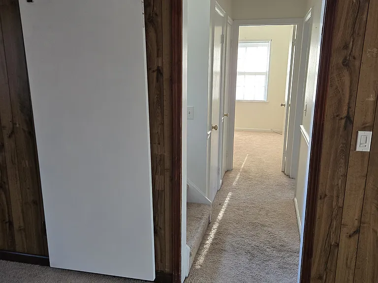 Family Room facing hallway leading to downstairs bedroom