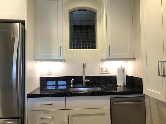 Kitchen sink; granite counter tops.