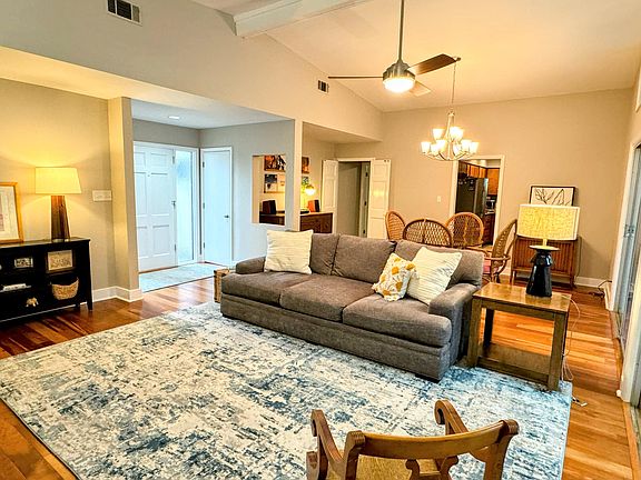 Huge, open living/dining area with hardwood floors and lots of sweet mid-century lines.