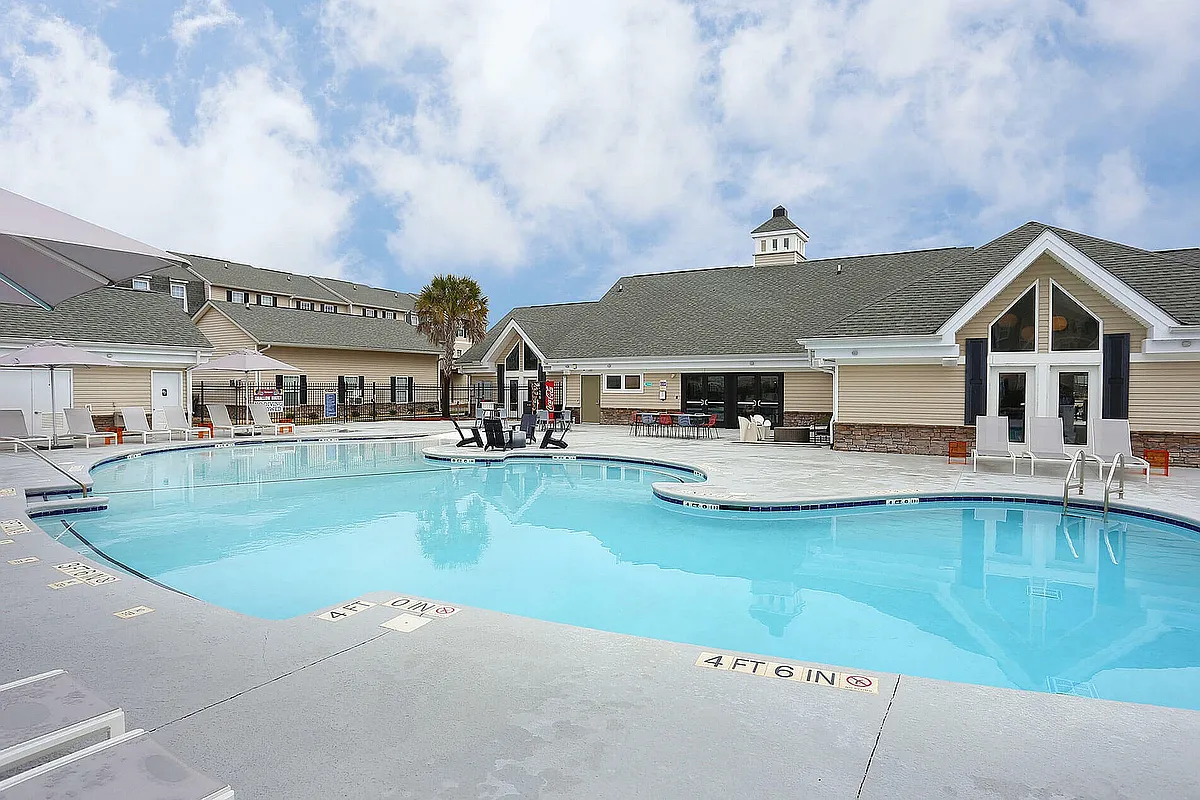Experience the ultimate relaxation at our luxurious poolside, perfect for sunny days. - Roost, The