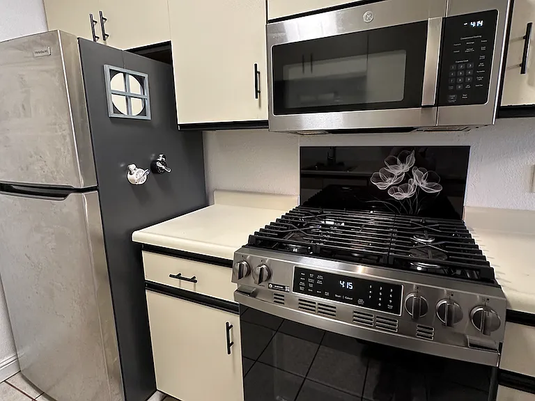 Stainless steel fridge, oven, microwave