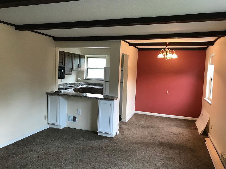 Breakfast bar with extra storage. Kitchen contains a microwa