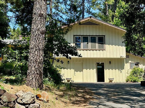 Driveway and Apartment on 2nd floor. Own entrance (open door).