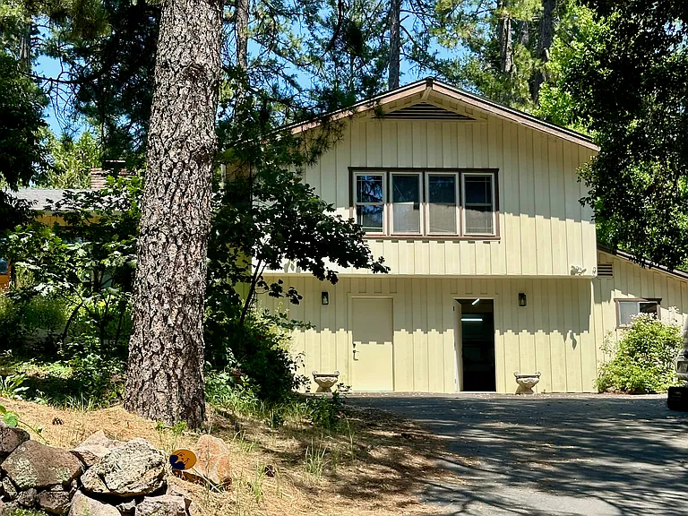 Driveway and Apartment on 2nd floor. Own entrance (open door).