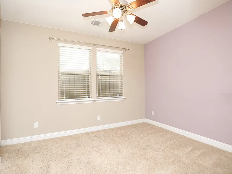 1st bedroom a level 1 / can be used as a study , opens to a side patio.