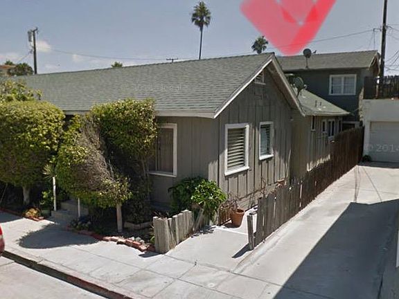 The upstairs unit with the red arrow pointing to the roof is