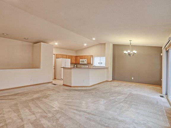 Great room overlooking kitchen and dining area. This room with have luxury vinyl wood-style flooring at move in.