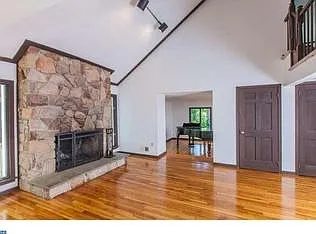 Keeping/family room facing sunken living room without furniture to illustrate space