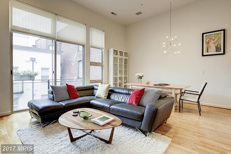 Living room with high ceilings and lots of light