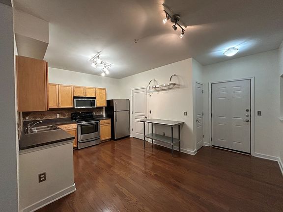 Full Size Kitchen with Stainless Appliances. Laundry Room off Kitchen. Coat Closet and Alcove by Front Foor.