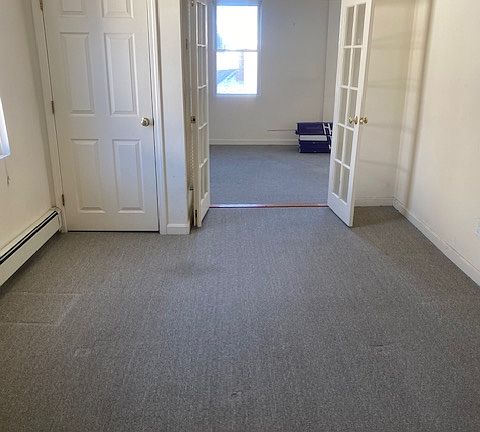 in bedroom looking at living room