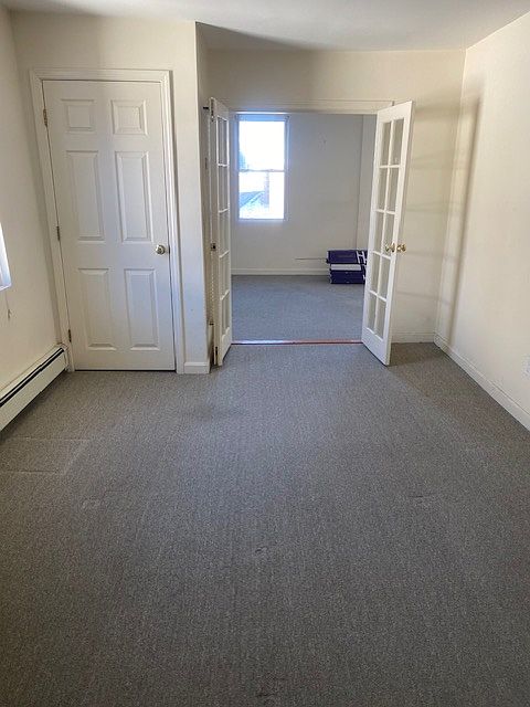 in bedroom looking at living room