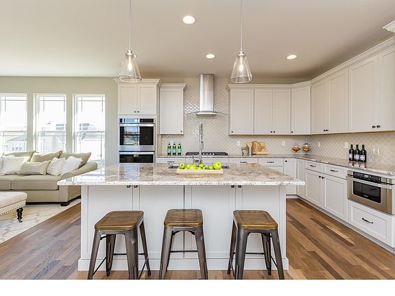 Kitchen With Center Island and Granite Countertops