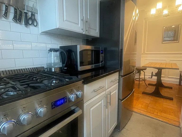 Galley kitchen with the view of the kitchen nook.
