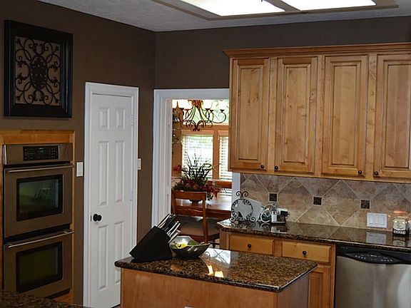 Kitchen has stainless steel appliances. maple cabinets