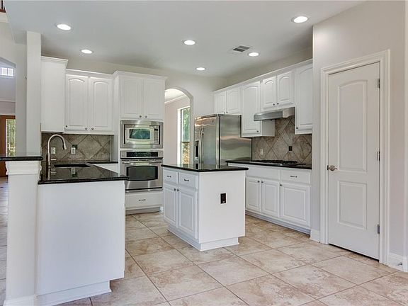 4th image of 11501 Woodland Hills Trl