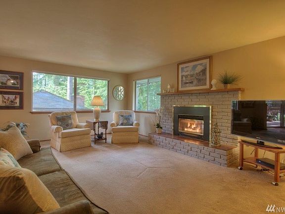 Another view of the living room with two large windows facing the back yard.