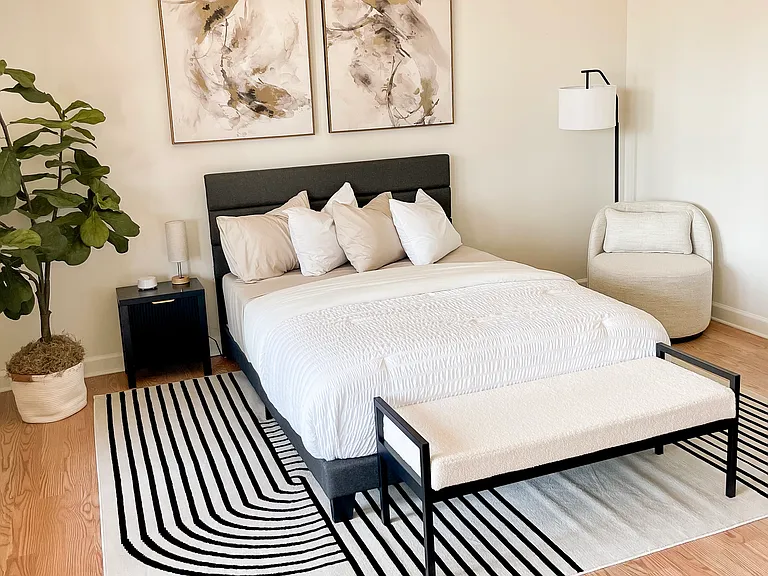 Private bedroom with queen bed, reading nook, and ample space to settle in.