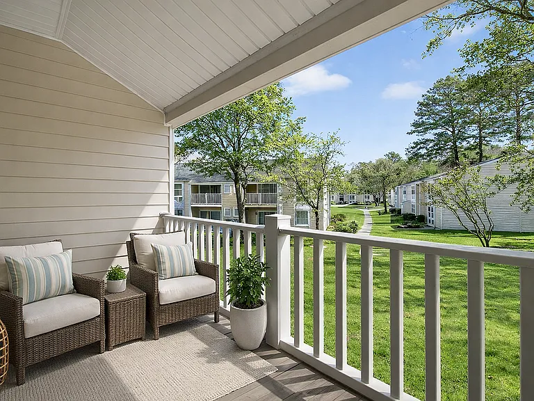 Sunny balcony with wicker seating