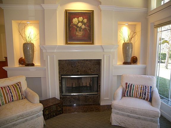 Custom mantle and display shelves with custom lighting!