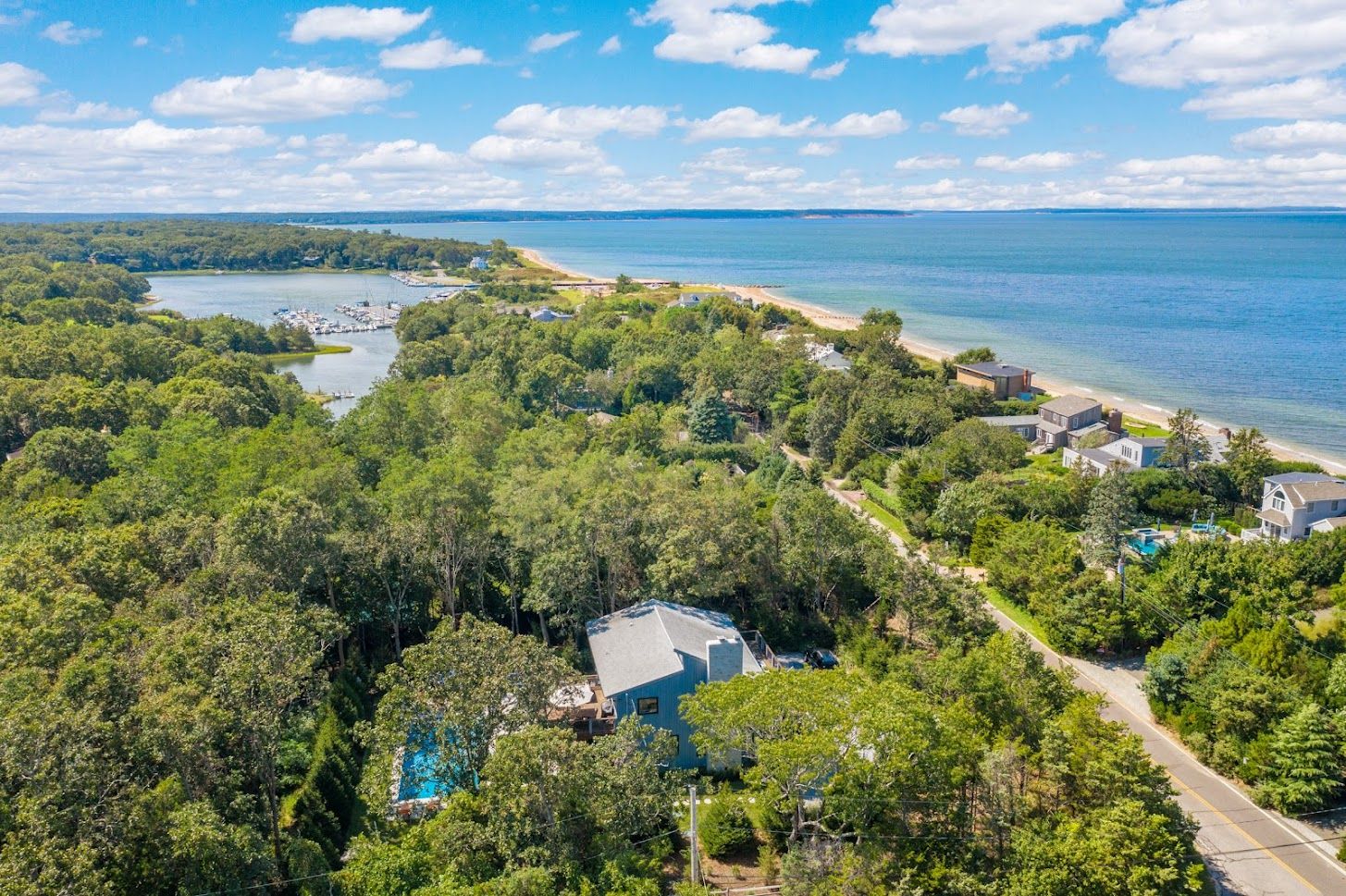 Stone's throw to the private beach and marina