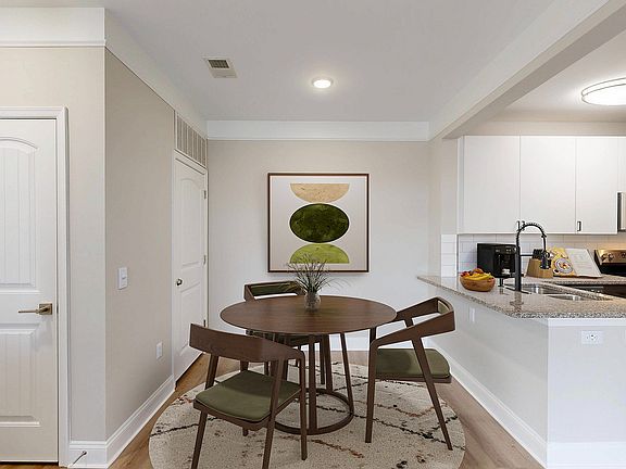 Newly Renovated Dining Room with Hardwood-Style Flooring