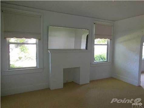 The living room features a fireplace