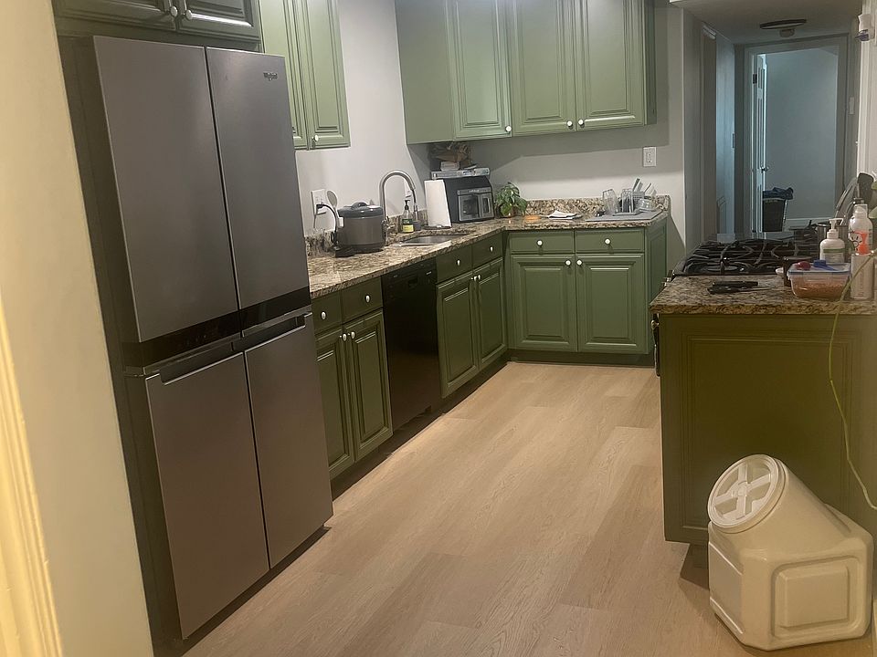 View of kitchen. Featuring custom cabinets and new flooring